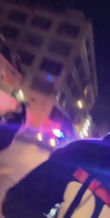 GIF of police cars and helicopter chasing scooter